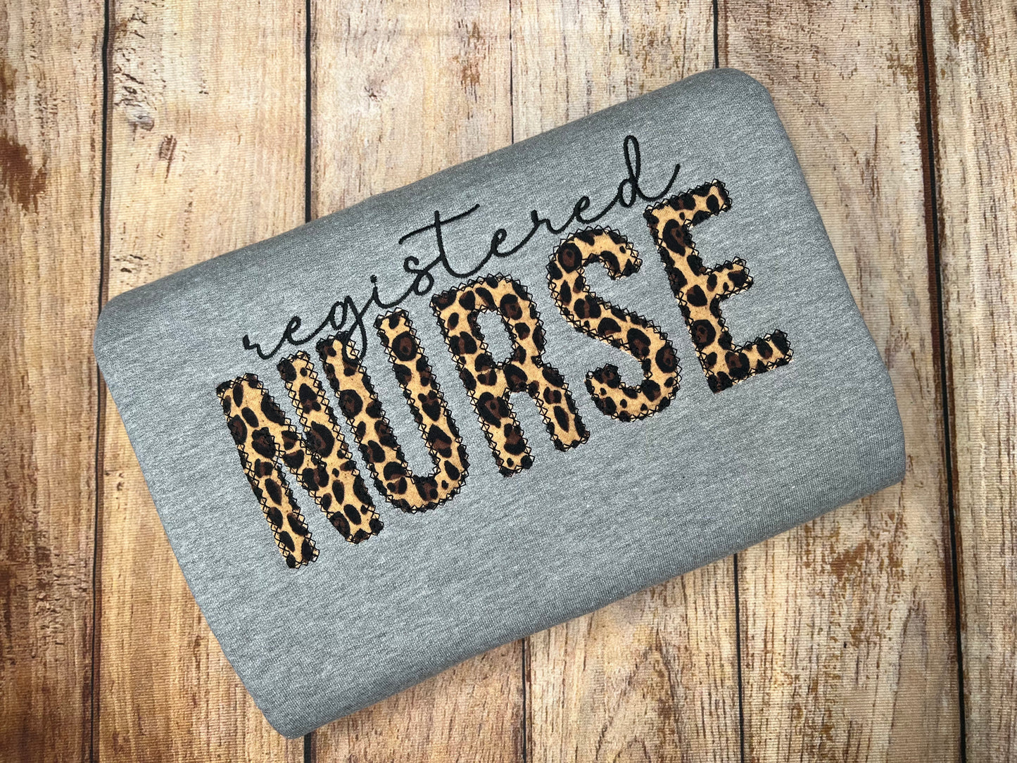 Registered Nurse cheetah appliqué sweatshirt